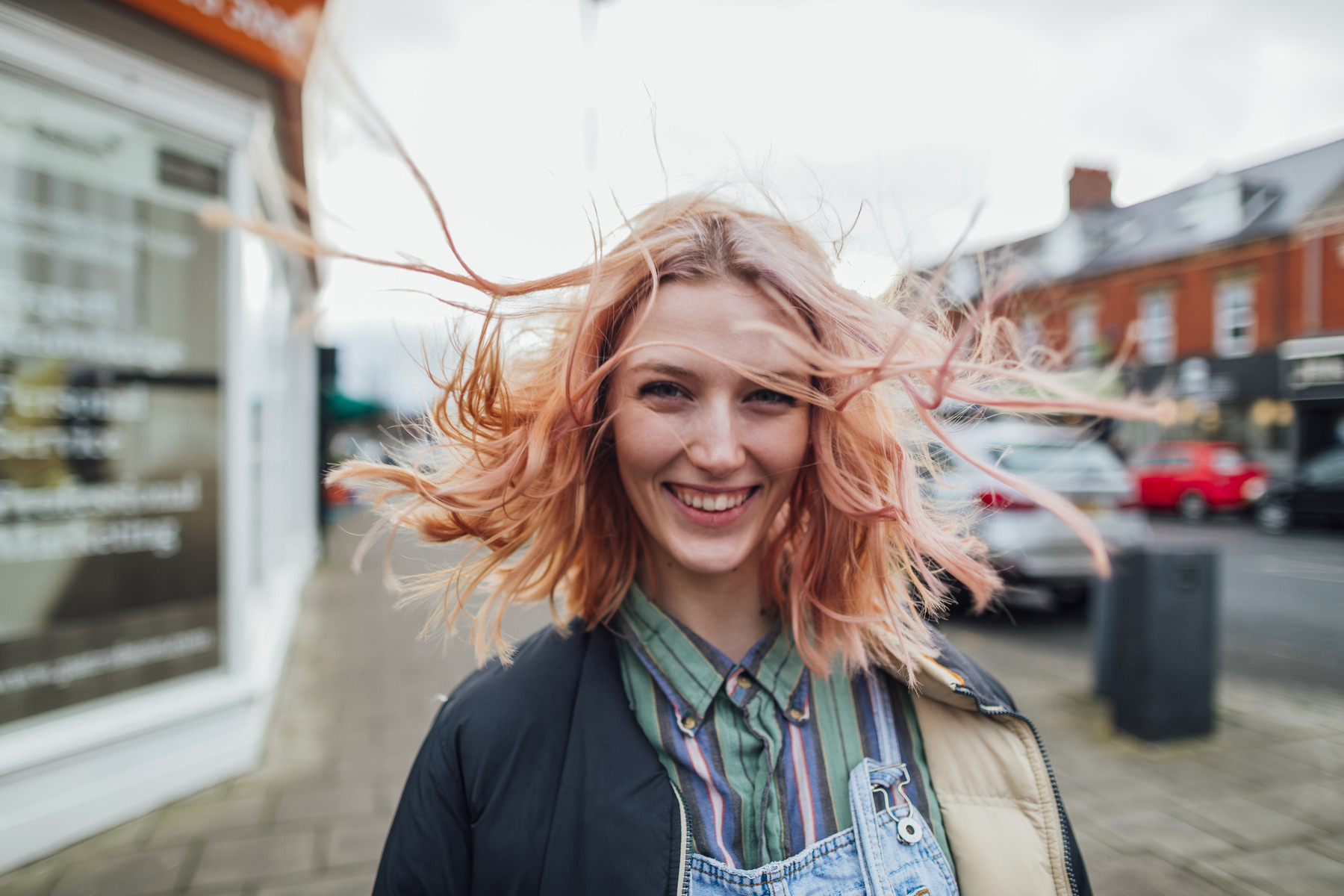 student outside on windy day